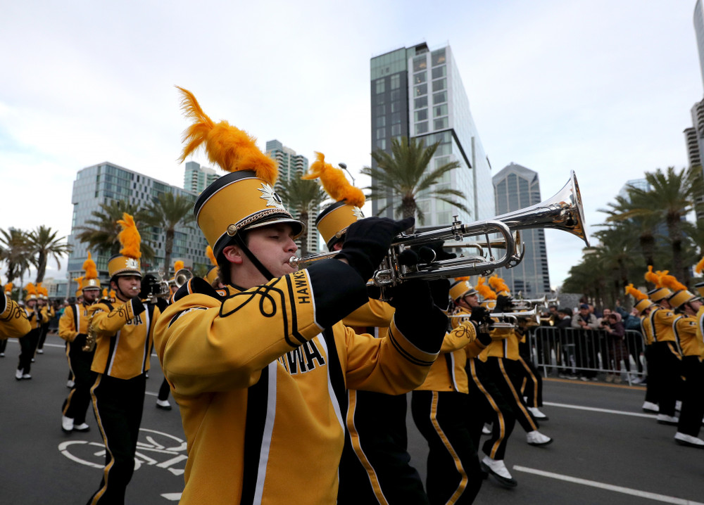 The Hawkeye Marching Band and the Iowa Spirit Squad march in the Holiday Bowl Parade Thursday, December 26, 2019 in San Diego. (Brian Ray/hawkeyesports.com)