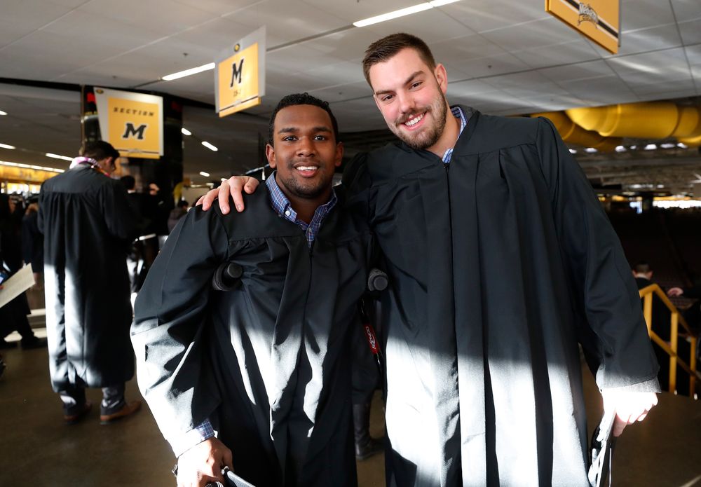 Iowa Hawkeyes defensive back Miles Taylor (19) and tight end Peter Pekar (86)