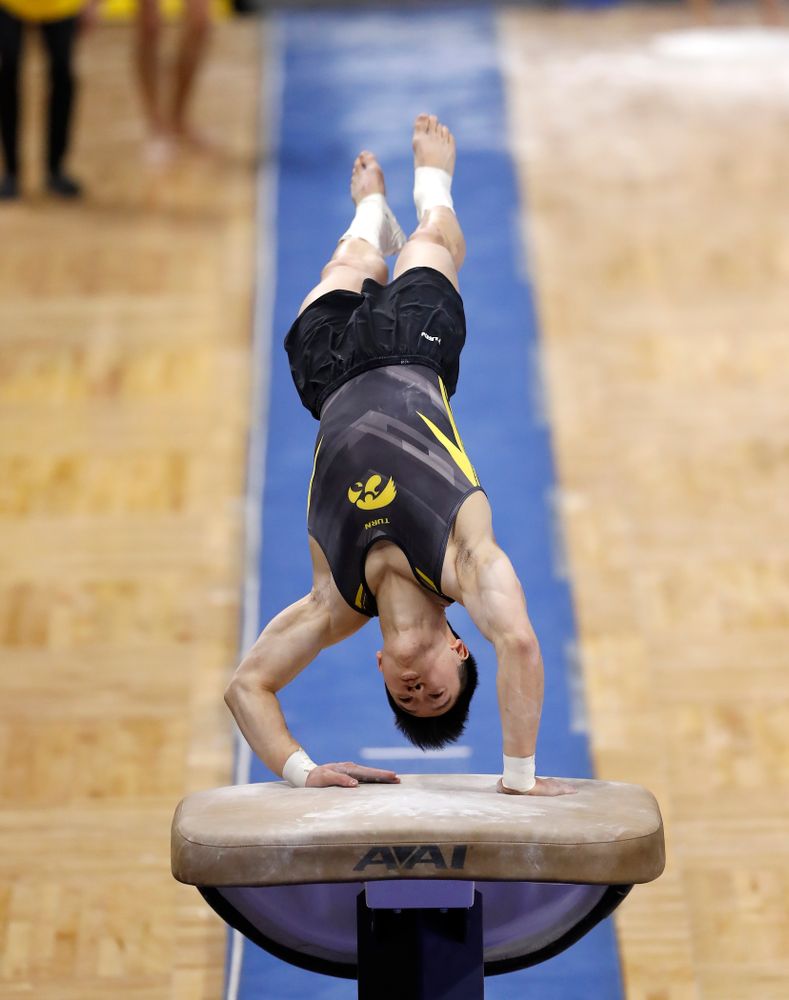 Bennet Huang competes on the vault against Illinois 