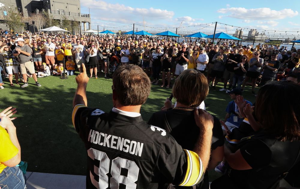 Fans chant "One More Year" as the Voice of the Hawkeyes Gary Dolphin introduces the family of Iowa Hawkeyes tight end T.J. Hockenson (38) during the Hawkeye Huddle Monday, December 31, 2018 at Sparkman Wharf in Tampa, FL. (Brian Ray/hawkeyesports.com)