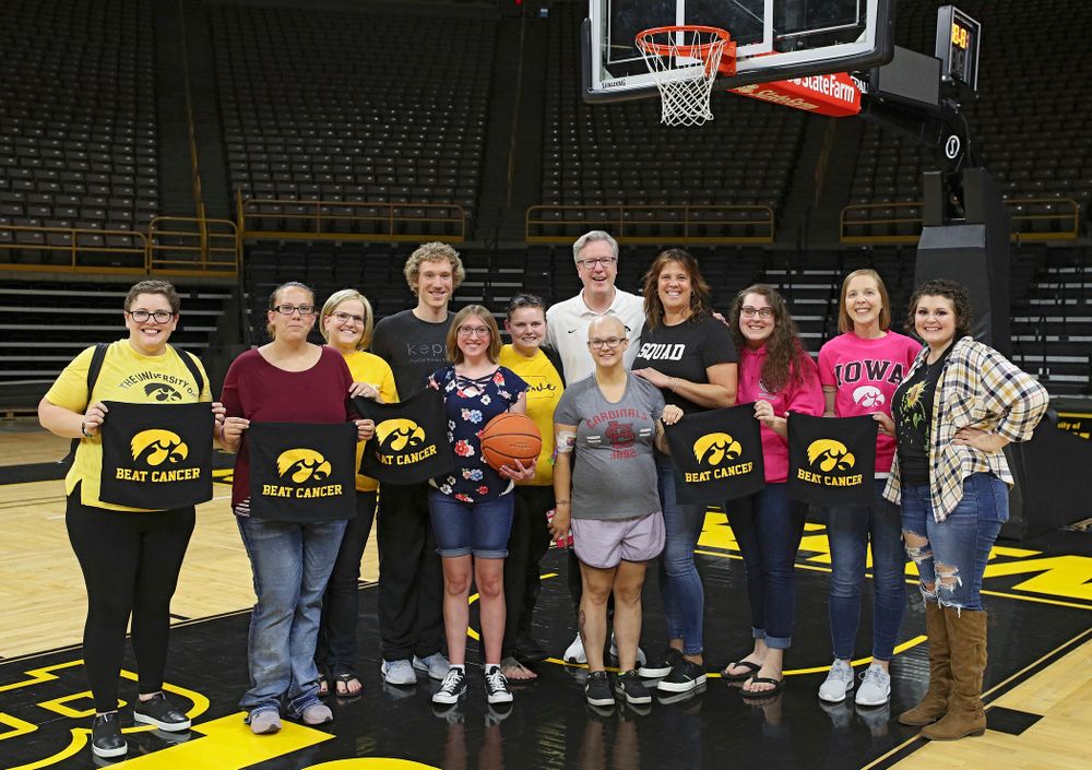 Iowa Hawkeyes head coach Fran McCaffery and Margaret McCaffery take pictures with visitors from the University of Iowa Hospitals and Clinics Adolescent and Young Adult (AYA) Cancer Program after practice at Carver-Hawkeye Arena in Iowa City on Monday, Sep 30, 2019. (Stephen Mally/hawkeyesports.com)