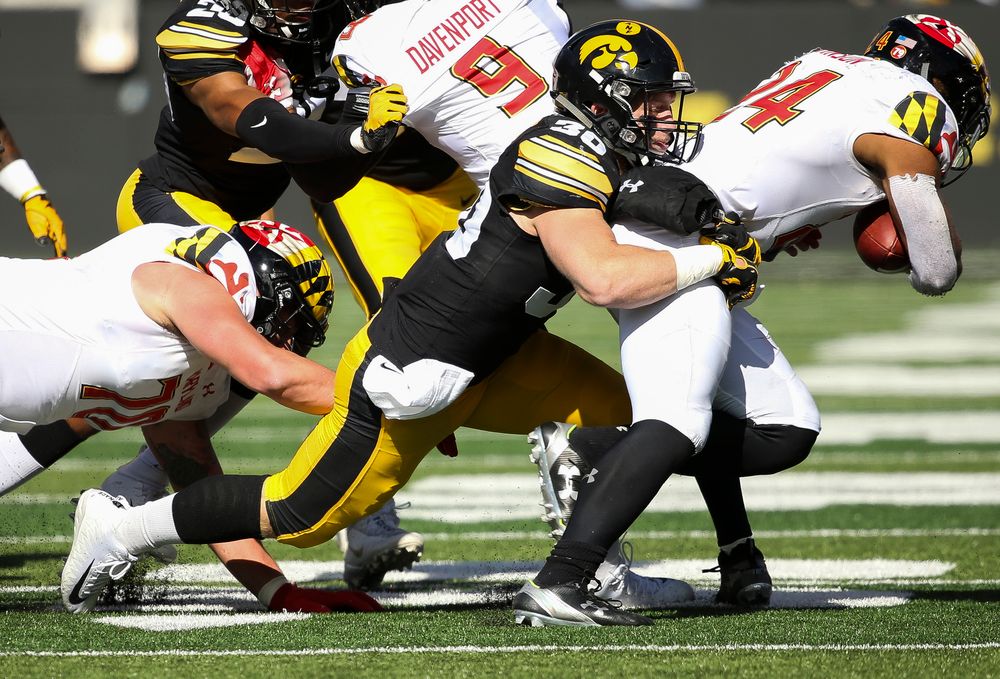 Iowa Hawkeyes defensive back Jake Gervase (30) makes a tackle during a game against Maryland at Kinnick Stadium on October 20, 2018. (Tork Mason/hawkeyesports.com)