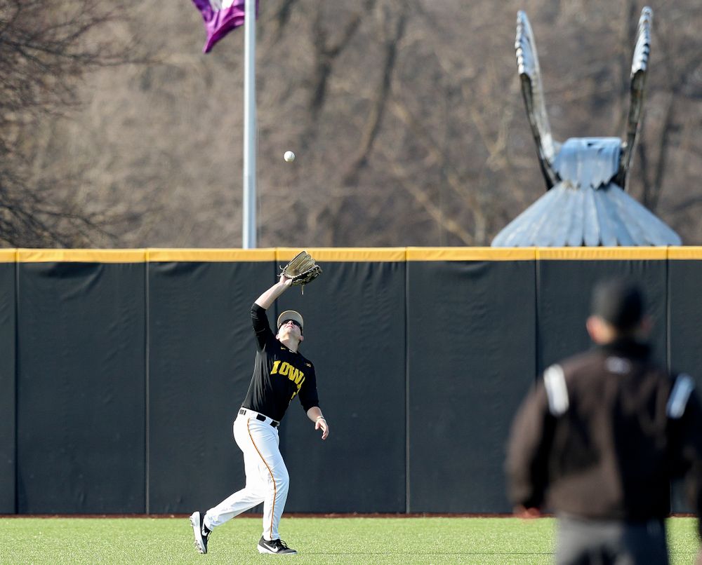 Iowa left fielder Zeb Adreon (5) pulls in a fly ball for an out during the third inning of their college baseball game at Duane Banks Field in Iowa City on Tuesday, March 10, 2020. (Stephen Mally/hawkeyesports.com)