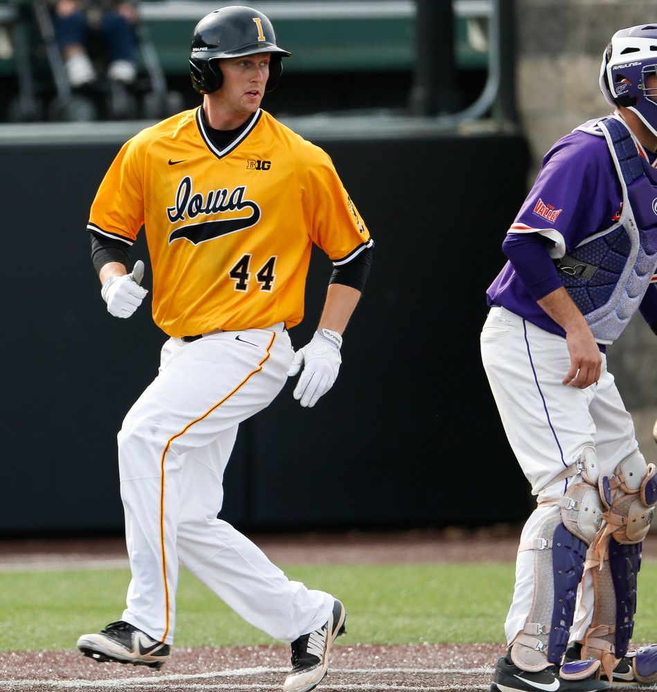 Iowa Hawkeyes outfielder Robert Neustrom (44) comes in to score during a game against Evansville at Duane Banks Field on March 18, 2018. (Tork Mason/hawkeyesports.com)