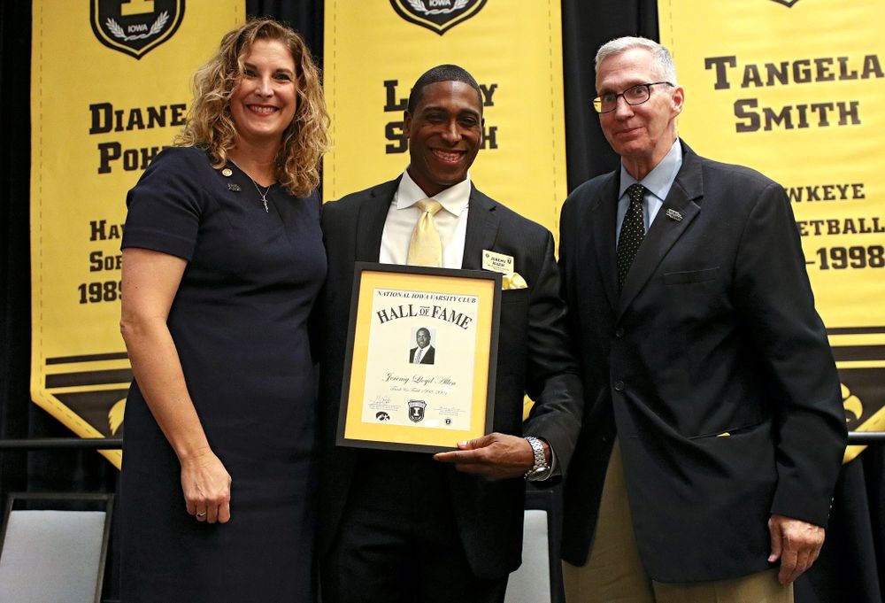 Barb Randall (from left), co-chair of the Varsity Club Advisory Committee, 2019 University of Iowa Athletics Hall of Fame inductee Jeremy Allen, and Andy Piro, assistant athletics director and executive director of the Varsity Club, during the Hall of Fame Induction Ceremony at the Coralville Marriott Hotel and Conference Center in Coralville on Friday, Aug 30, 2019. (Stephen Mally/hawkeyesports.com)