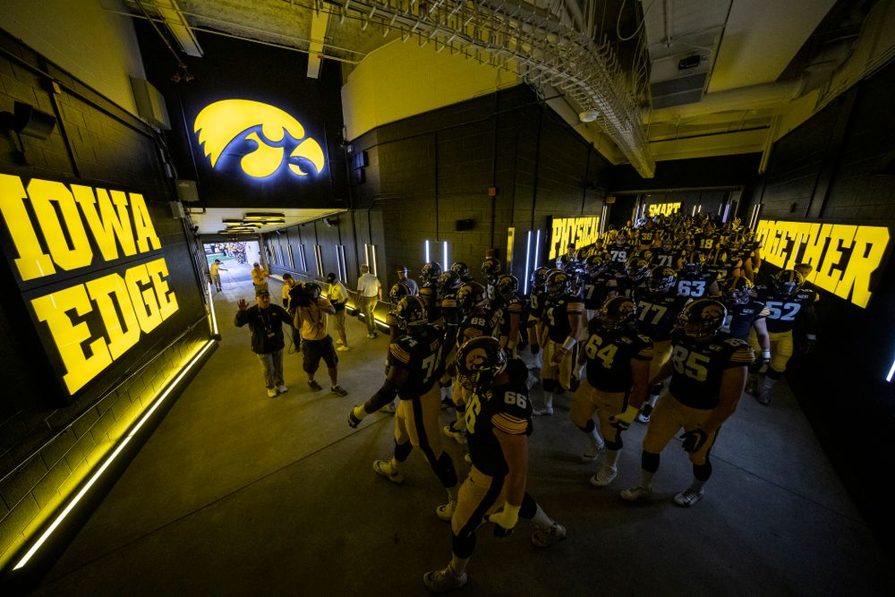 The Iowa Hawkeyes take the field in their new home tunnel before their game against the Miami RedHawks Saturday, August 31, 2019 at Kinnick Stadium in Iowa City. (Brian Ray/hawkeyesports.com)