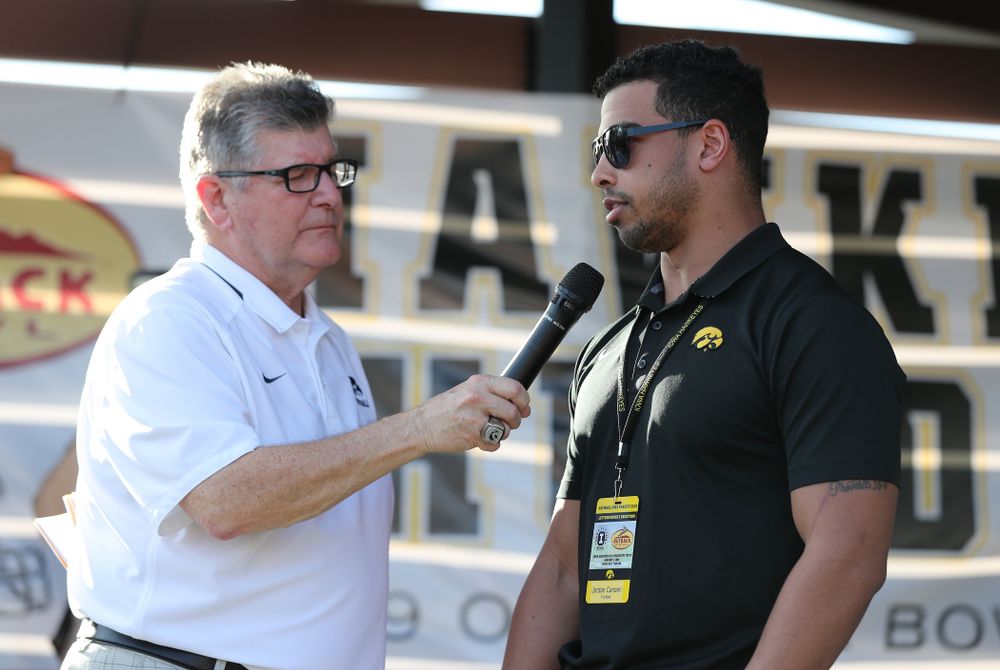Voice of the Hawkeyes Gary Dolphin speaks with former Hawkeye Football running back Jordan Canzeri during the Hawkeye Huddle Monday, December 31, 2018 at Sparkman Wharf in Tampa, FL. (Brian Ray/hawkeyesports.com)