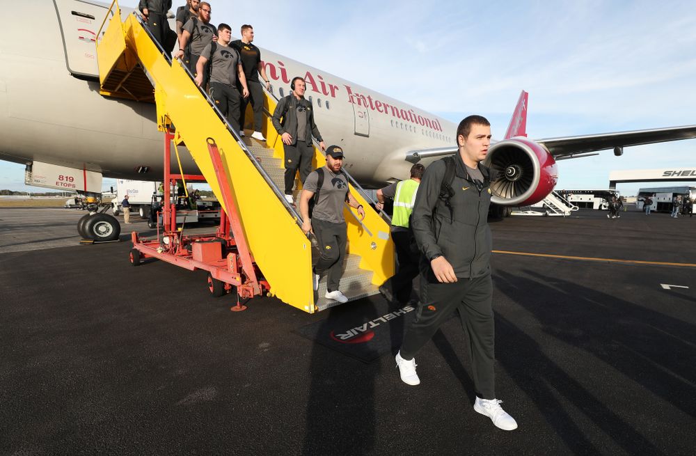 Iowa Hawkeyes quarterback Nate Stanley (4) disembarks the team plane Wednesday, December 26, 2018 as they arrive in Tampa, Florida for the Outback Bowl. (Brian Ray/hawkeyesports.com)