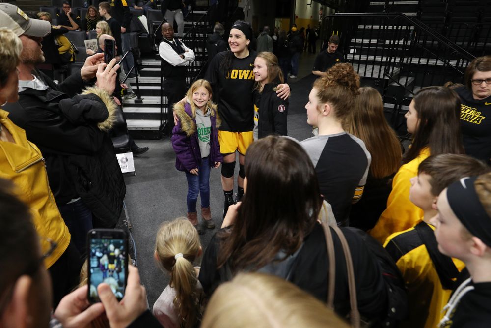Iowa Hawkeyes forward Megan Gustafson (10) takes, photos, signs autographs, and gives hugs following senior day ceremonies Sunday, March 3, 2019 at Carver-Hawkeye Arena. (Brian Ray/hawkeyesports.com)