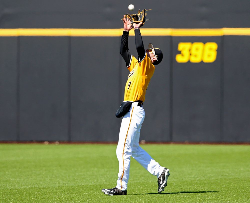 Iowa Hawkeyes center fielder Ben Norman (9) pulls in a fly ball for an out during the sixth inning against Illinois at Duane Banks Field in Iowa City on Sunday, Mar. 31, 2019. (Stephen Mally/hawkeyesports.com)